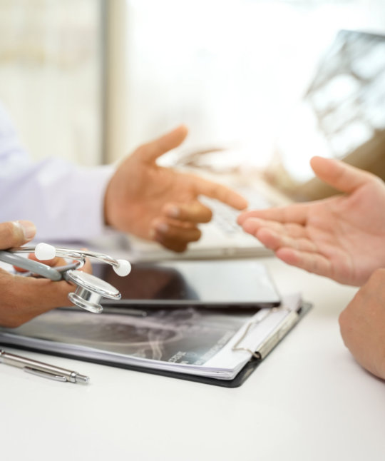 a close-up of hands holding a stethoscope