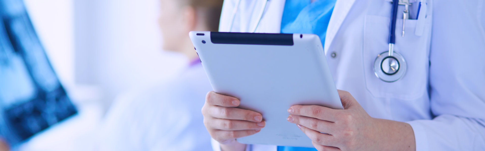 Close up shoot of doctor holding a tablet device